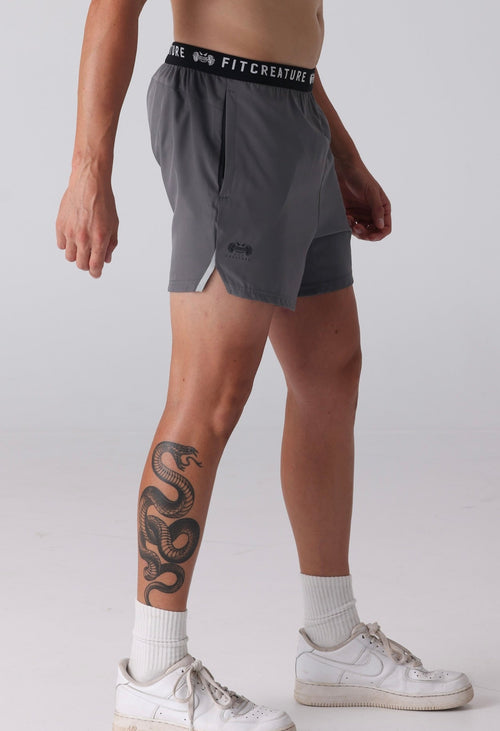 grey gym shorts with elastic band waist and minimal logo